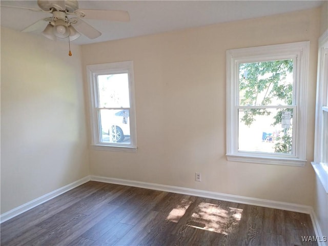 2205 18th Ave, Northport, AL 35476 - spare room featuring healthy amount of natural light, dark wood-type flooring, baseboards, and ceiling fan