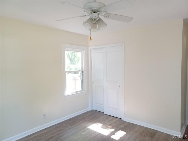 2205 18th Ave, Northport, AL 35476 - empty room featuring wood finished floors, a ceiling fan, and baseboards