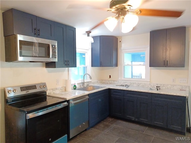 2205 18th Ave, Northport, AL 35476 - kitchen featuring stainless steel appliances, plenty of natural light, a sink, and ceiling fan