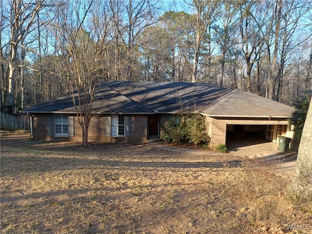 ranch-style home with brick siding and an attached garage