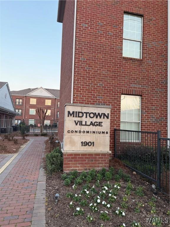 community sign with fence