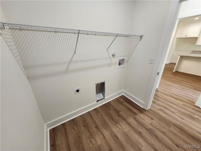 195 Lecroy Cir, Brent, AL 35034 - laundry room with hookup for an electric dryer, dark wood-style flooring, baseboards, hookup for a washing machine, and hookup for a gas dryer