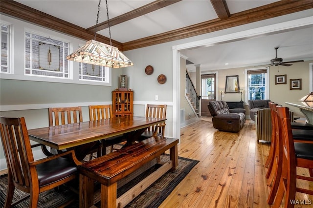 dining space featuring ceiling fan, crown molding, and light hardwood / wood-style flooring