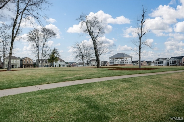 view of community featuring a yard