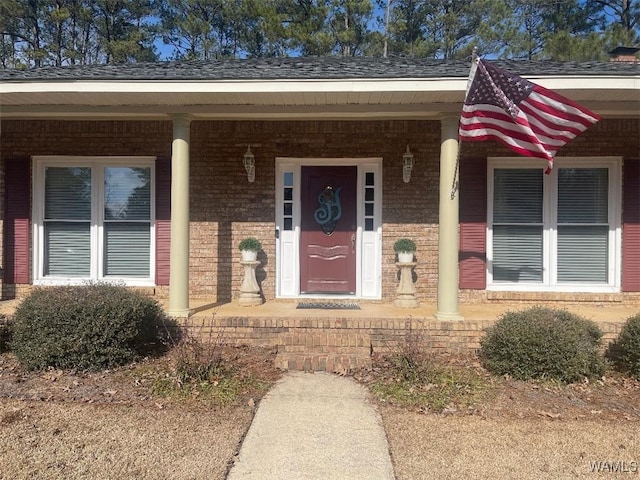 property entrance featuring covered porch