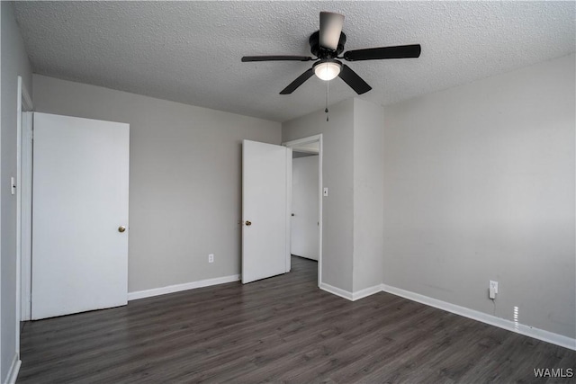 unfurnished bedroom with a textured ceiling, dark wood-type flooring, a ceiling fan, and baseboards