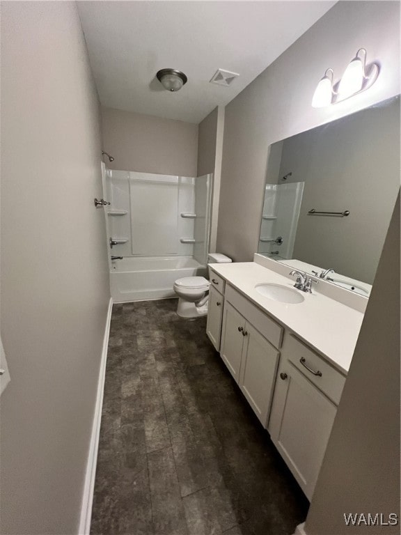 full bathroom with vanity, shower / bathtub combination, and toilet