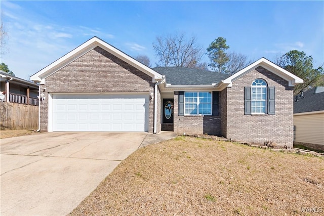 single story home featuring a garage, driveway, brick siding, and a front lawn