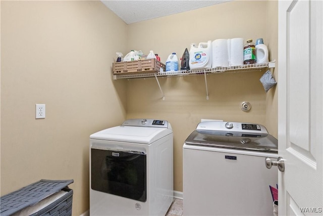 laundry area with laundry area and independent washer and dryer