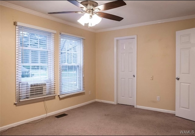 806 Arrowhead Vlg, Winfield, AL 35594 - spare room featuring crown molding, baseboards, a ceiling fan, and carpet
