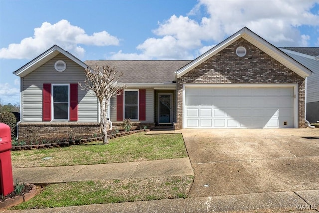 ranch-style home featuring a front yard, concrete driveway, brick siding, and an attached garage