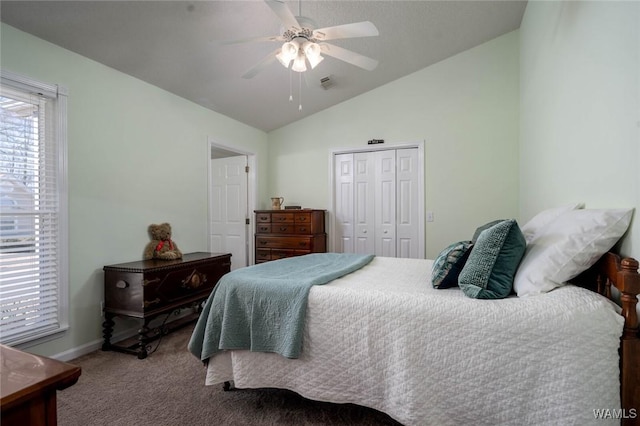 bedroom featuring visible vents, a ceiling fan, lofted ceiling, carpet, and a closet