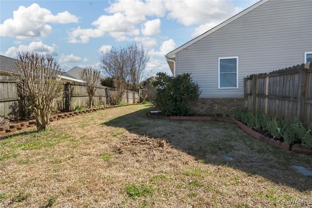 view of yard with a fenced backyard