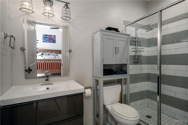 bathroom featuring a stall shower, ensuite bath, toilet, and vanity