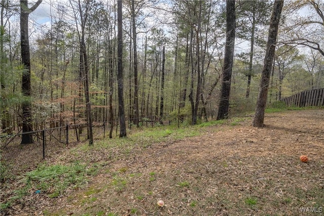 view of landscape featuring a wooded view