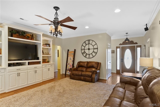 living room featuring ceiling fan, light hardwood / wood-style floors, and crown molding