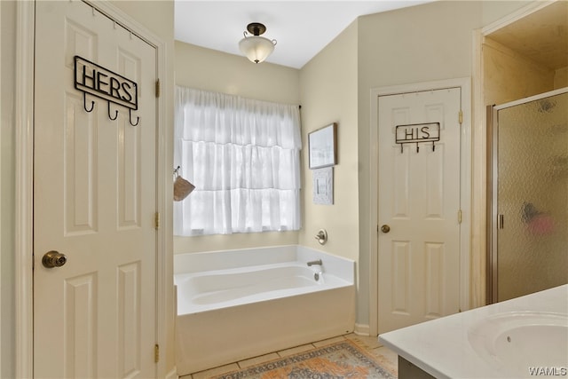 bathroom with separate shower and tub, tile patterned flooring, and vanity