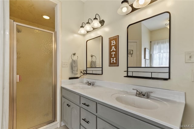 bathroom with vanity and an enclosed shower