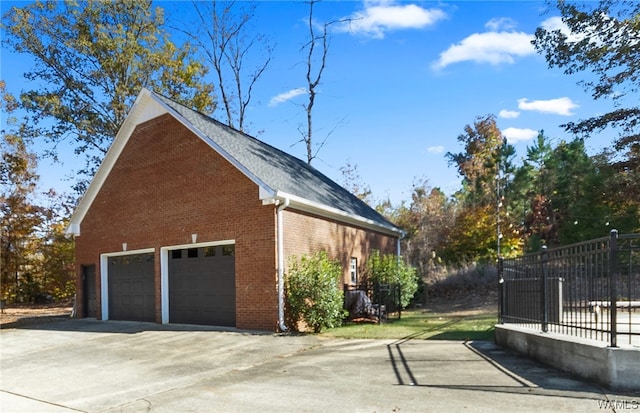 view of side of property with a garage