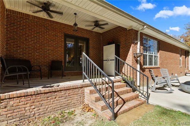 property entrance featuring ceiling fan and french doors