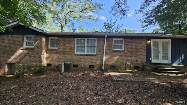 rear view of house featuring central AC, a patio area, and french doors