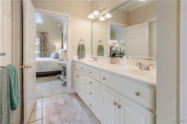 ensuite bathroom featuring a sink, tile patterned flooring, ensuite bath, and crown molding