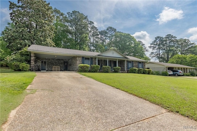 3709 Diamond Ln, Northport, AL 35473 - single story home featuring concrete driveway, a front lawn, an attached carport, and stone siding
