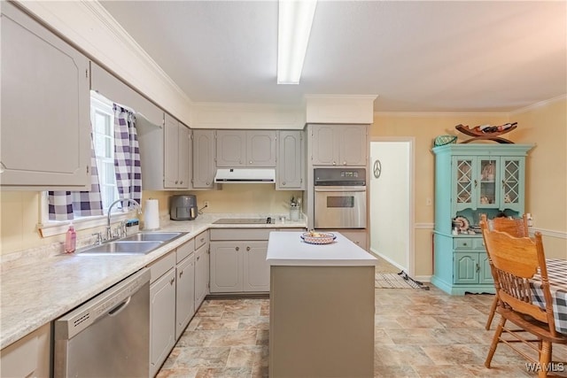 3709 Diamond Ln, Northport, AL 35473 - kitchen with stainless steel appliances, a sink, gray cabinets, under cabinet range hood, and crown molding