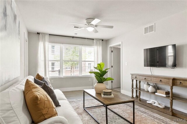 680 6th Ave NE Unit 3401, Tuscaloosa, AL 35404 - kitchen with appliances with stainless steel finishes, sink, decorative backsplash, dark brown cabinets, and light wood-type flooring