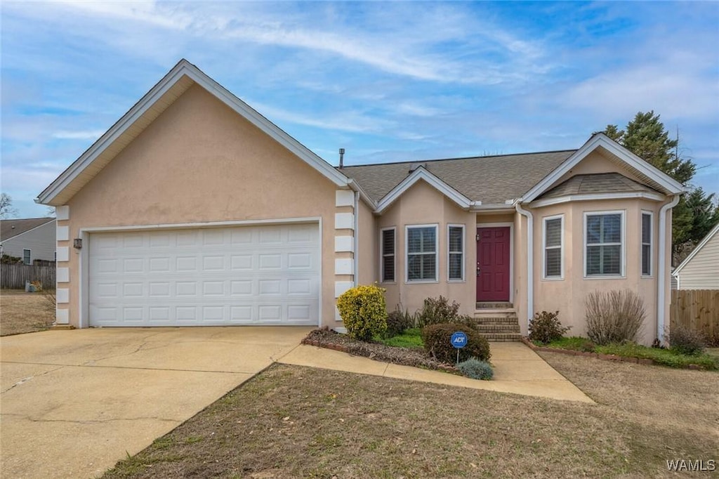 single story home featuring a garage