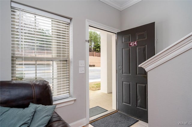 foyer featuring crown molding