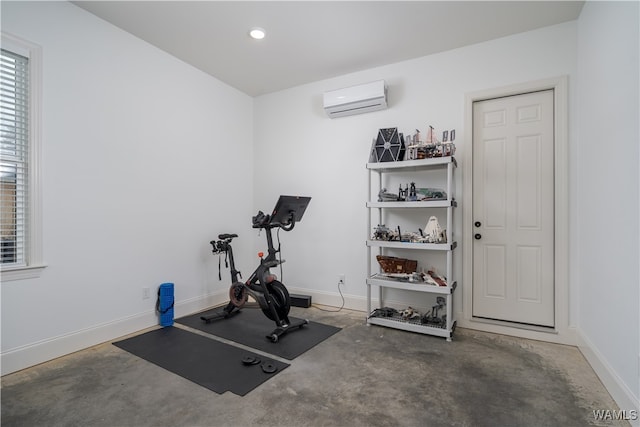 exercise area featuring a wall unit AC