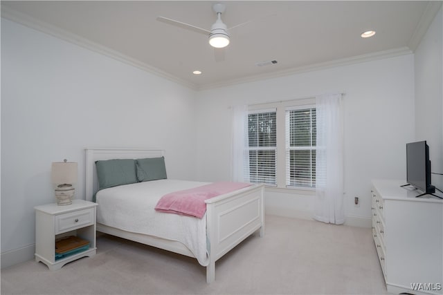 bedroom featuring ceiling fan, light colored carpet, and ornamental molding