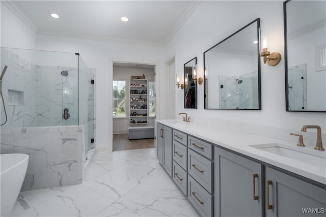 bathroom with crown molding, vanity, and shower with separate bathtub