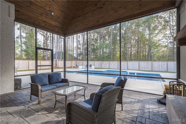 sunroom with wooden ceiling and lofted ceiling