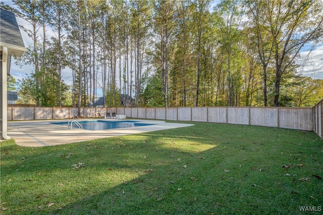 view of yard with a patio and a fenced in pool