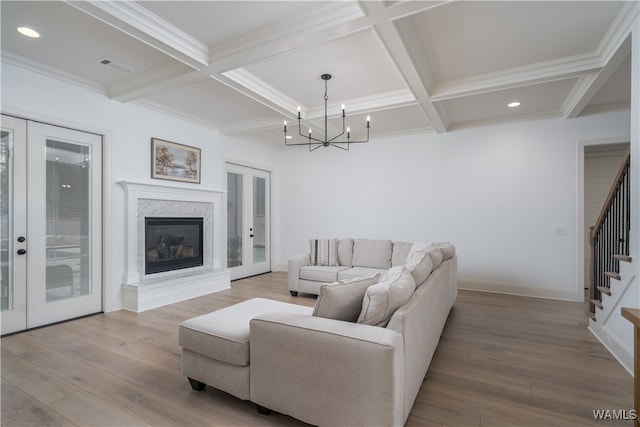 living room with french doors and hardwood / wood-style floors