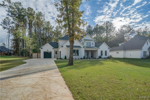 modern farmhouse style home featuring a front yard and a garage