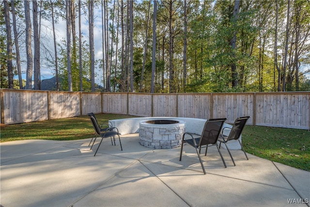 view of patio with a fire pit