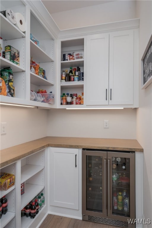 pantry featuring wine cooler