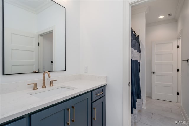 bathroom with vanity and crown molding