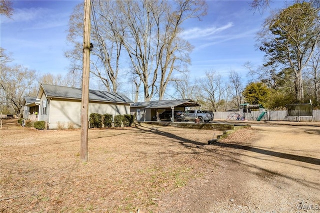 view of front facade featuring a playground and a trampoline