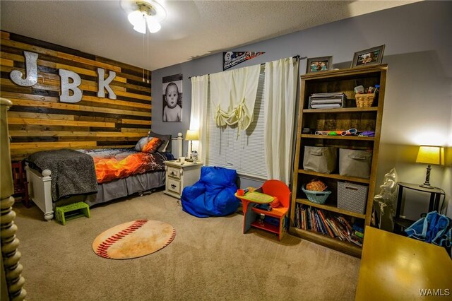 bedroom featuring carpet floors and a textured ceiling