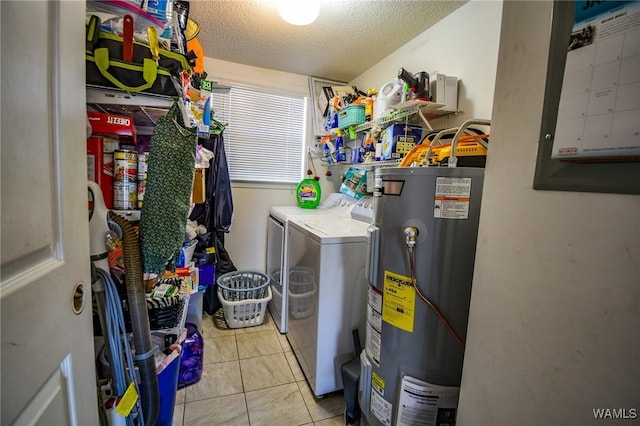 laundry room with water heater, separate washer and dryer, light tile patterned floors, electric panel, and a textured ceiling