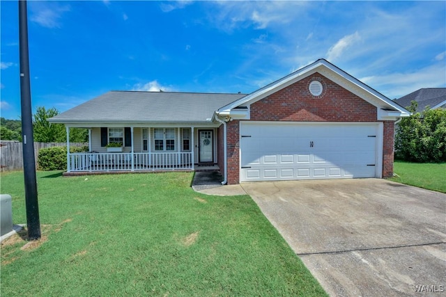 2630 Shady Bank Ln, Northport, AL 35473 - single story home featuring covered porch, concrete driveway, brick siding, and a garage