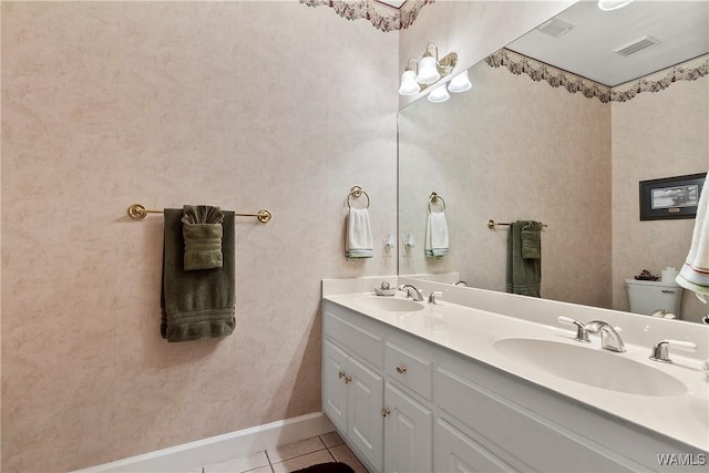 full bathroom with toilet, visible vents, a sink, and tile patterned floors