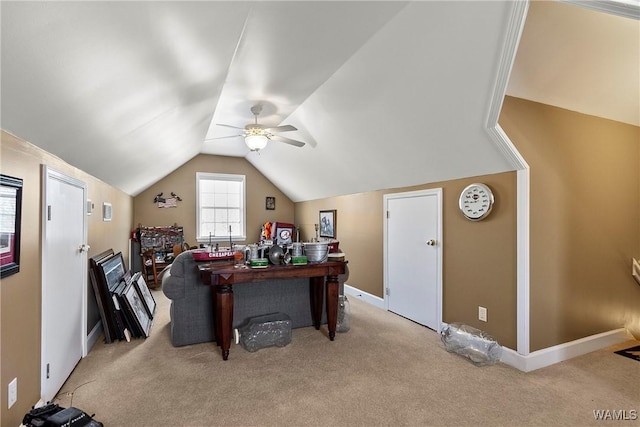 office featuring lofted ceiling, baseboards, carpet floors, and a ceiling fan