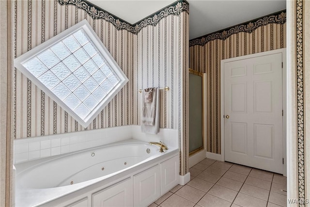 bathroom with a shower stall, tile patterned flooring, a jetted tub, baseboards, and wallpapered walls