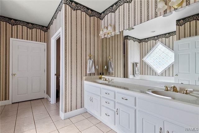 full bath featuring tile patterned floors, a sink, baseboards, and wallpapered walls