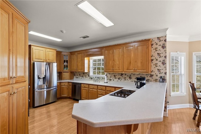 kitchen with ornamental molding, dishwasher, a peninsula, stainless steel fridge with ice dispenser, and black electric cooktop